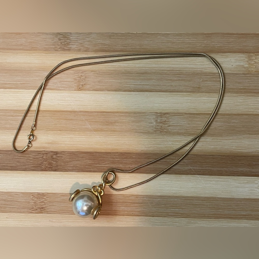 Vintage large faux pearl and gold tone pendant on a gold tone snake chain